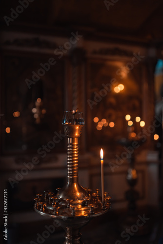 Candles in front of icons in the church
