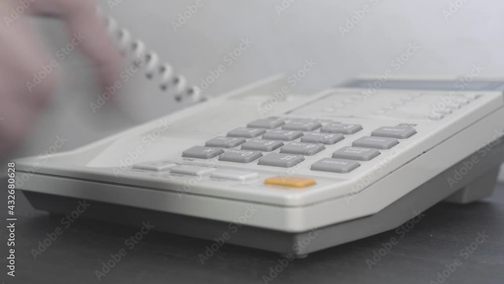 Phone in the hotel room. A landline telephone in a hotel or office for communication with employees, room service. Close-up Phone in the hotel room. A landline telephone in a hotel or office for communication with employees, room service. Close-up