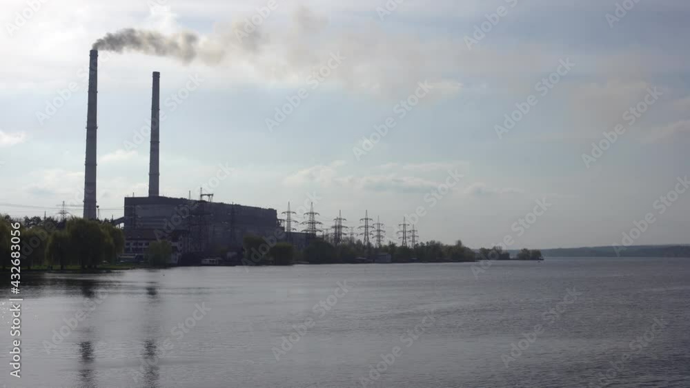 Panoramic view of power station Lukomlskaya Gres. Chimneys with smoke of power plant. Ecological problem. Environmental pollution concept. Panoramic view of power station Lukomlskaya Gres. Chimneys with smoke of power plant. Ecological problem. Environmental pollution concept.