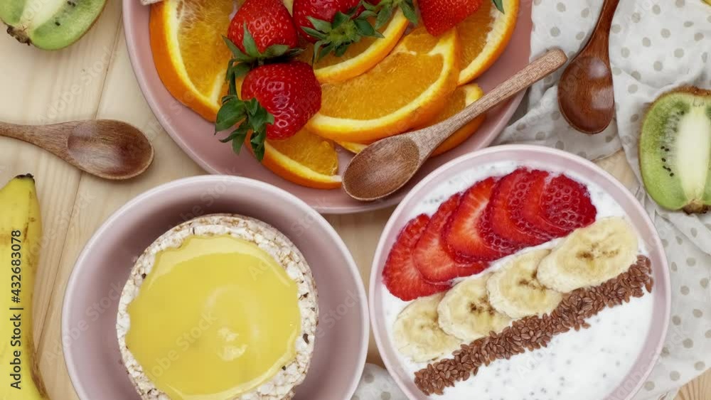 Sweet breakfasts. Granola with strawberries and banana and freshly chopped orange wedges, garnished with various fruits, sweet breakfasts Sweet breakfasts. Granola with strawberries and banana and freshly chopped orange wedges, garnished with various fruits, sweet breakfasts