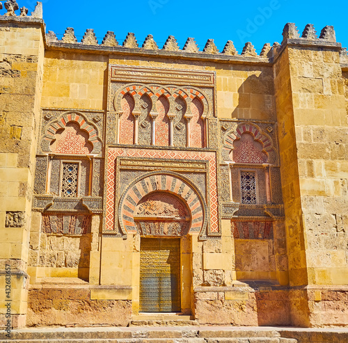 The splendid Moresque Puerta del Espiritu Santo gate of Mezquita, Torrijos street, Cordoba, Spain photo