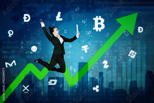Businesswoman jump with growth cryptocurrency graph © Creativa Images