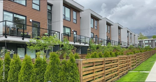 Establishing shot of modern apartment building with stairs and beautiful landscape in Vancouver, Canada, North America. Night time on May 2021. Still camera view. ProRes 422 HQ.