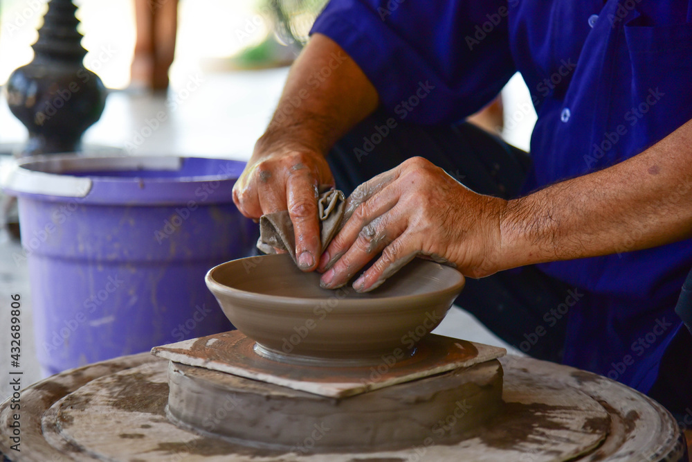 Making Sangkhalok Crockery with Clay by Hand Forming at Si Satchanalai, Sukhothai Province, Thailand