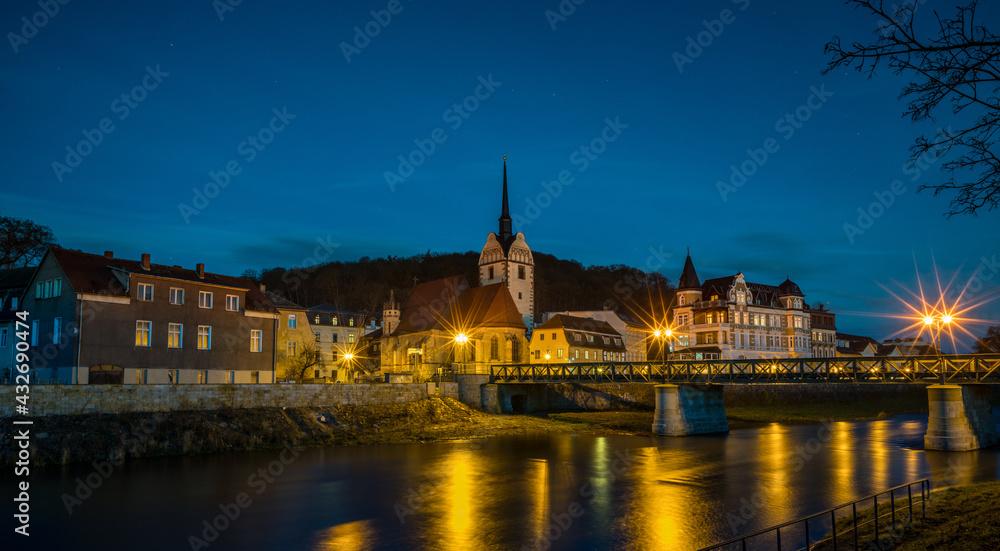 Night view of the ancient castle by the river