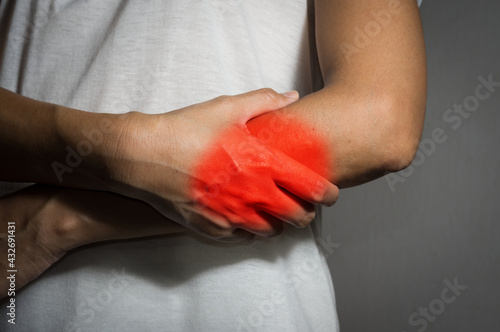 Girl suffering from fore arm pain.