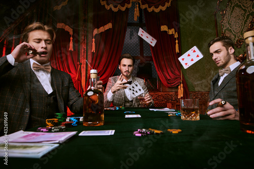 gambler throws cards photo