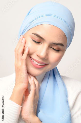close up of young beautiful muslim woman with hijab isolated on white background studio, muslim beauty skin care concept.