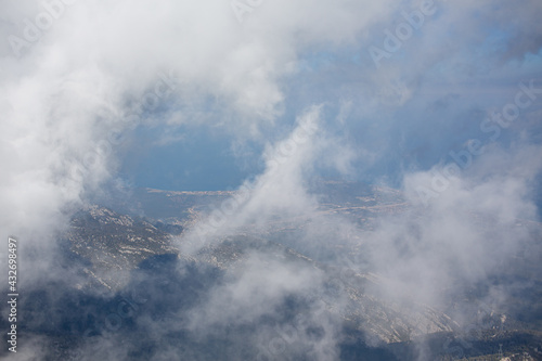 Mediterranean sea and cost view from the mountain summit through clouds © Alona Gryadovaya