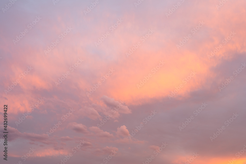 Colourful pink sky with clouds at golden hour. Basque Coast of France.