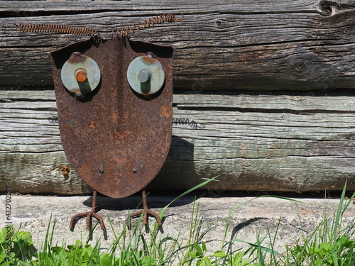 Owl from scrap metal. Garden decor. Sculpture from garbage. Waste art photo