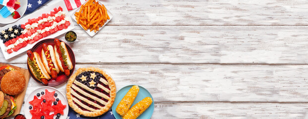 Fourth of July, patriotic, American themed food. Above view corner border on a white wood banner background. Copy space.