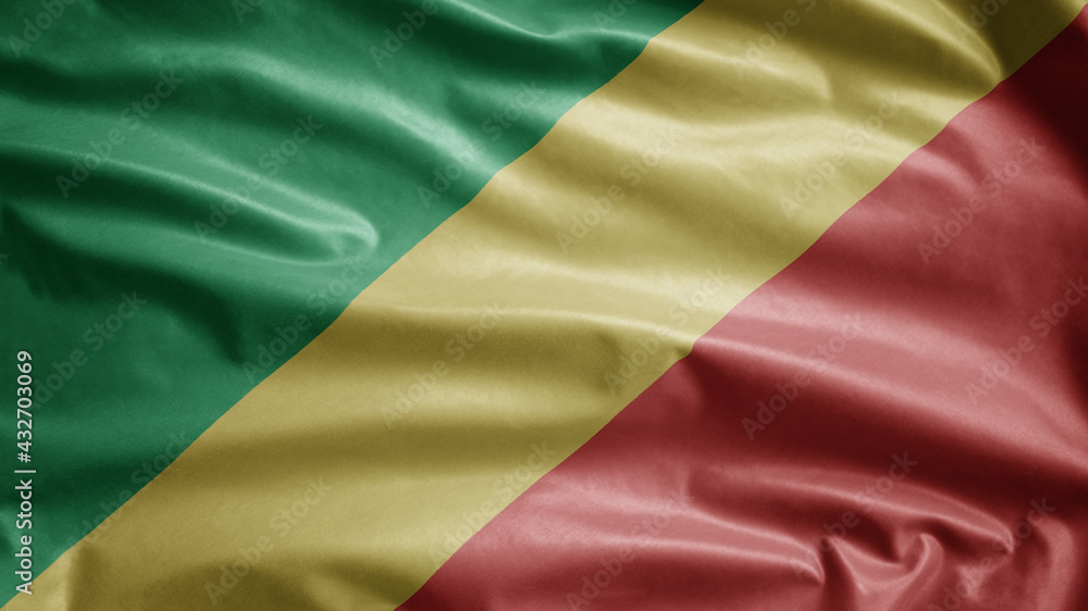 Congolese flag waving in the wind. Republic of Congo banner blowing soft silk.