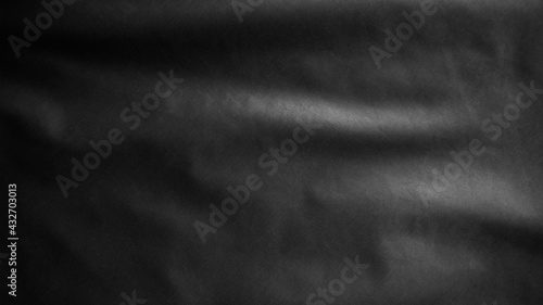 Black textile cloth flag, background abstract with soft waves