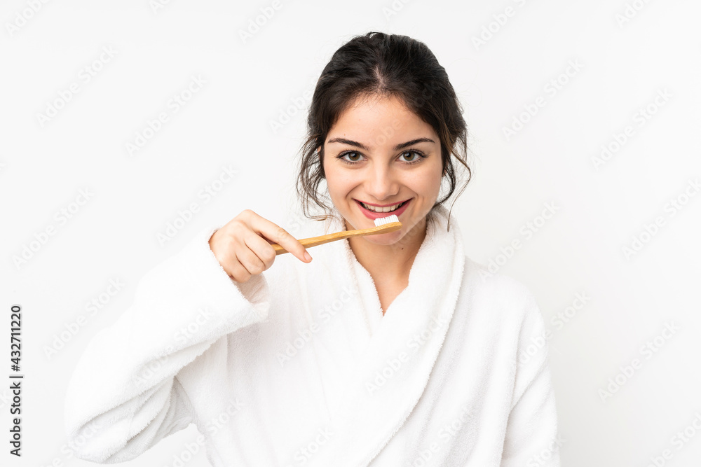 Young caucasian woman isolated on white background with a toothbrush and happy expression Young caucasian woman isolated on white background with a toothbrush and happy expression