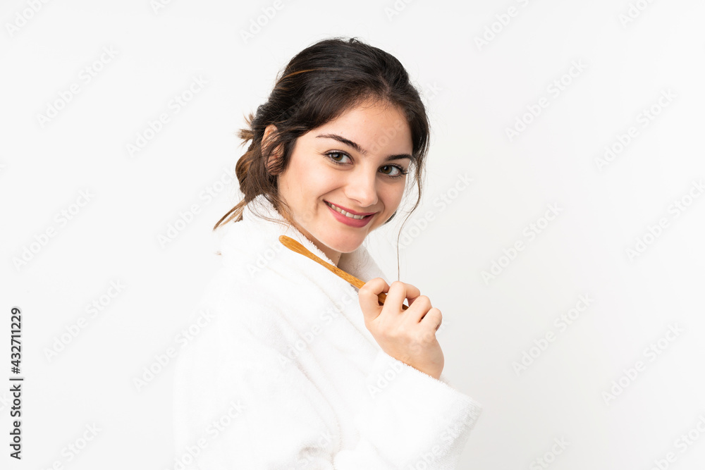 Young caucasian woman isolated on white background with a toothbrush and happy expression Young caucasian woman isolated on white background with a toothbrush and happy expression