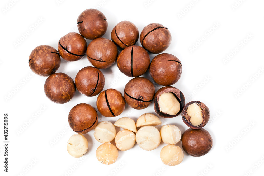 Macadamia nuts heap isolated on a white background. Top view. Macadamia nuts heap isolated on a white background. Top view.