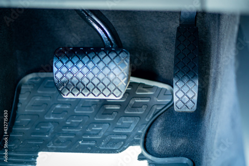 Brake food pedal and acceleration pedal. Close up detailed photo