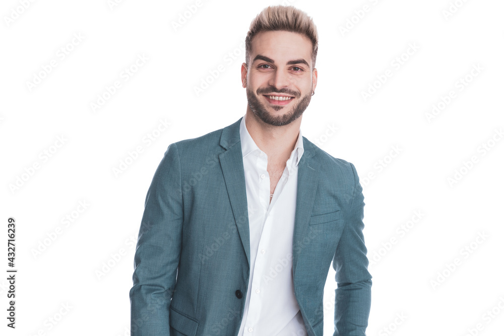 happy young businessman in suit smiling on white background