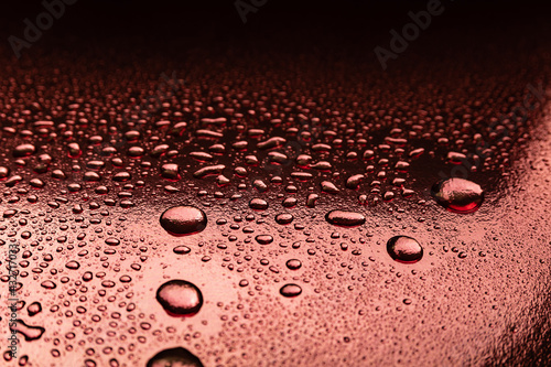 Abstract background with water drops on a copper surface