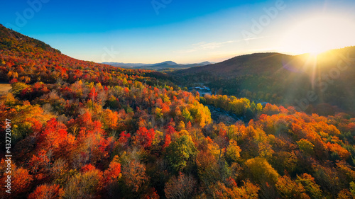Aerial view of Mountain Forests with Brilliant Fall Colors in Autumn at Sunrise, New England photo