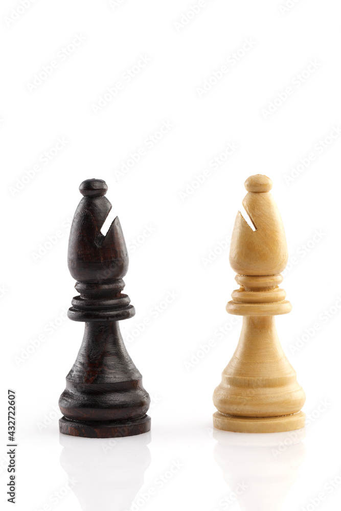 Two chess elephant are standing next to each other, isolated on a white background. Close-up. Two chess elephant are standing next to each other, isolated on a white background. Close-up.