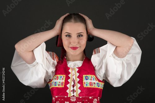 Young beautiful slovak woman in traditional dress. Slovak folklore photo