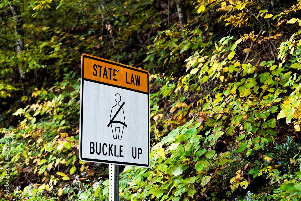 Virginia state law buckle up sign for car seat belt text sign on road in mountain Highland county, VA