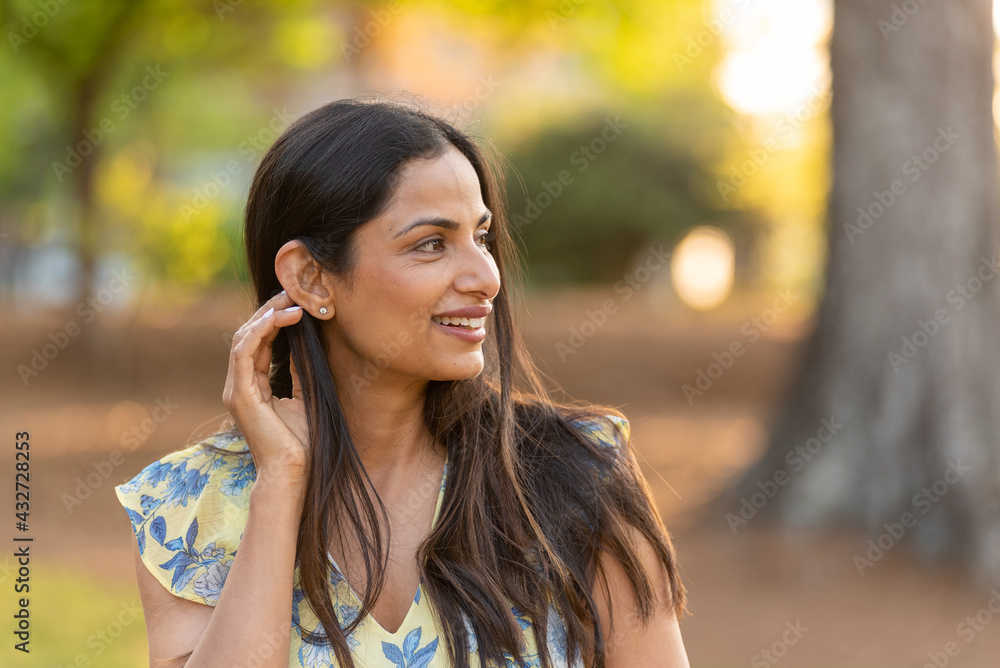 Outdoor headshots of beautiful Asian Indian woman. Outdoor headshots of beautiful Asian Indian woman.