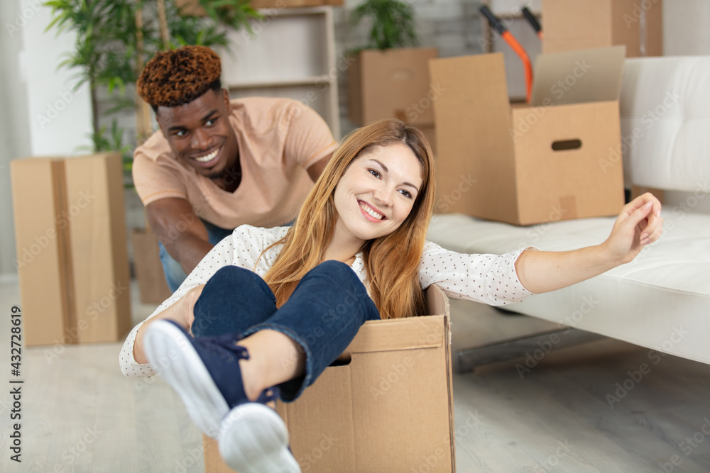 young couple moving in new home young couple moving in new home