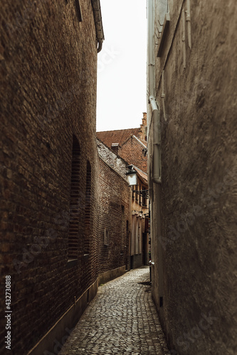 narrow street old town stone winding road © yuriy