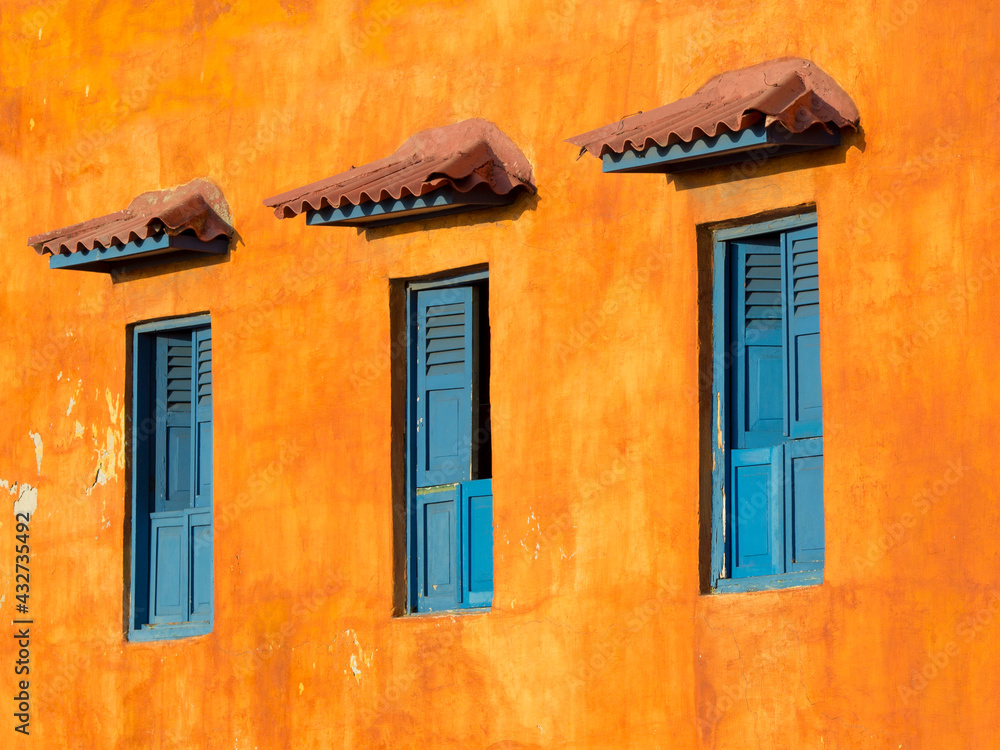 view of three colorful windows in Cartagena de Indias, Colombia