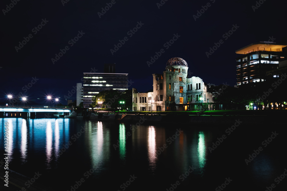 The Atomic Bomb Dome, memorial for the second world war, along the river in the night, Hiroshima, Japan The Atomic Bomb Dome, memorial for the second world war, along the river in the night, Hiroshima, Japan