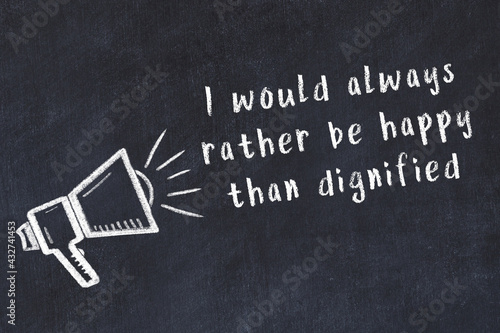Obraz na plátně Chalk loudspeaker and wise quote on black desk