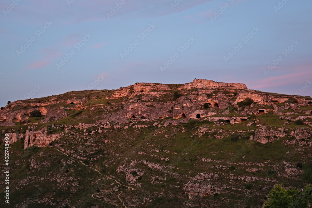 Fototapeta premium the beautiful stones of Matera and their caves at sunset
