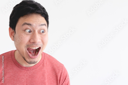 Wow and shocked face of funny Asian man isolated on white background.