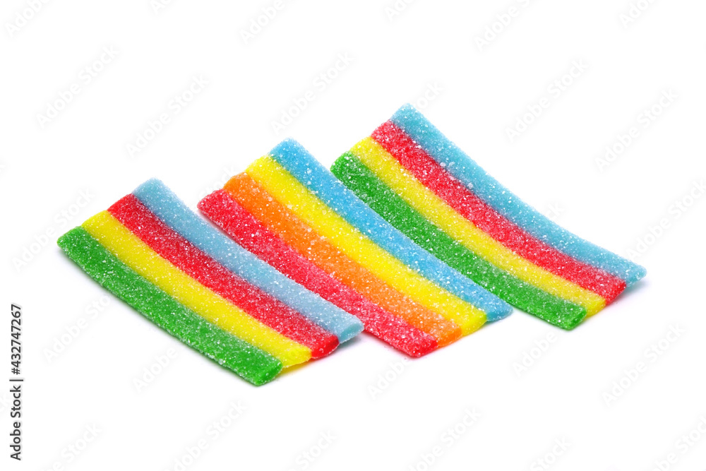 Fototapeta premium Rainbow chewy jelly isolated on white background. Colorful jelly candy. Unhealthy food, toxic kids food