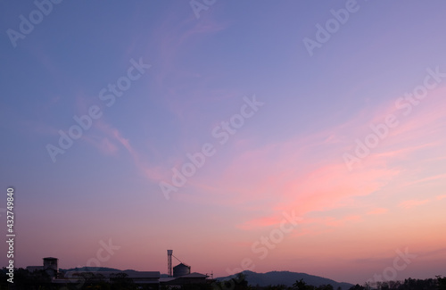 Colorful sunset and sunrise with clouds.Blue and orange color of nature.Many white clouds in the blue sky.The weather is clear today.sunset in the clouds.The sky is twilight. © gexphos