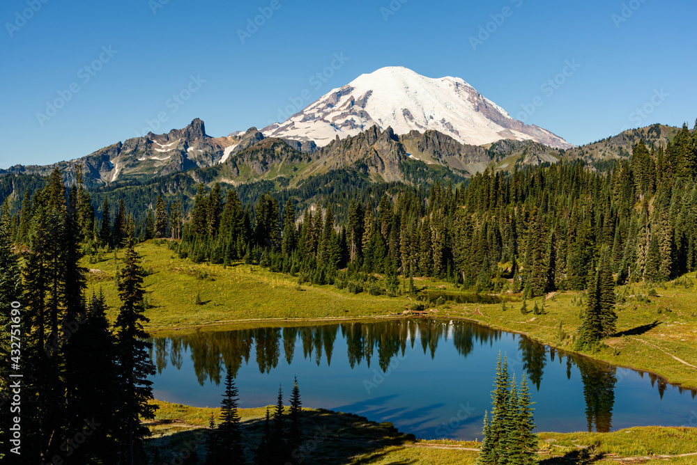 Summer fades at Tipsoo Lake as the volcanic peak of Mount Rainier dominates the horizon in the National Park south of Seattle