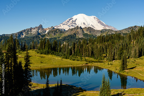 Summer fades at Tipsoo Lake as the volcanic peak of Mount Rainier dominates the horizon in the National Park south of Seattle photo