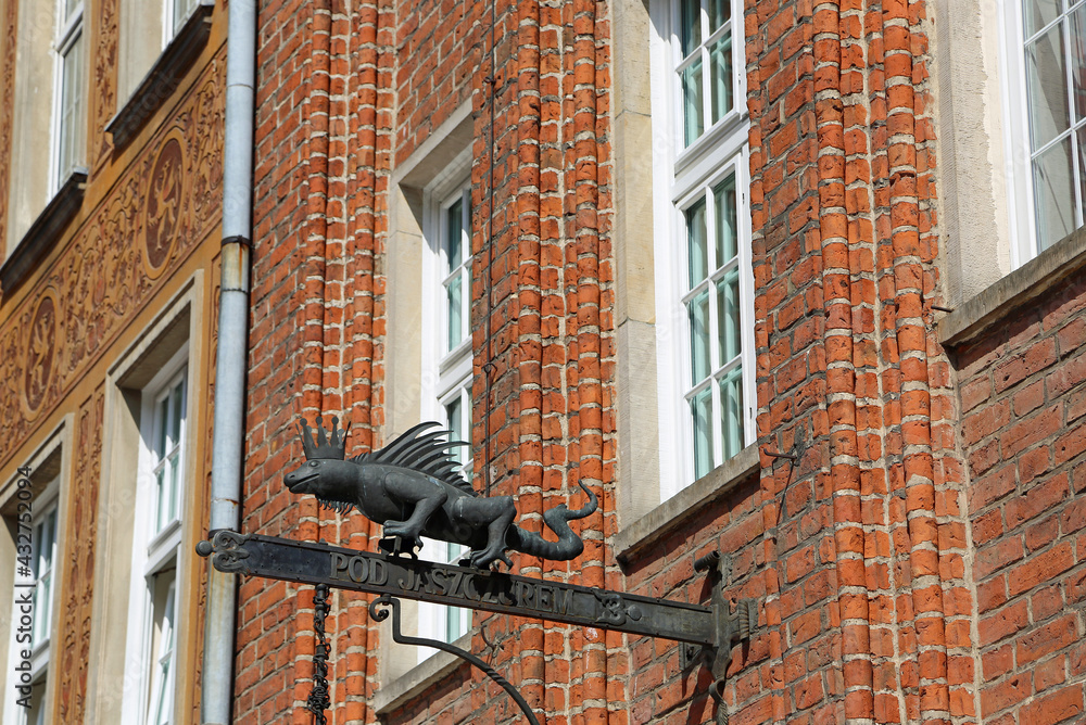 Saurian sign on historic tenement - Gdansk, Poland