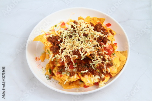 Freshly made nachos with ground beef and cheese