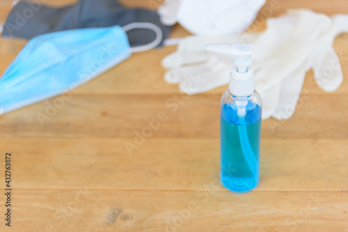 sanitizer gel for cleaning the hand and Medical rubber gloves on background