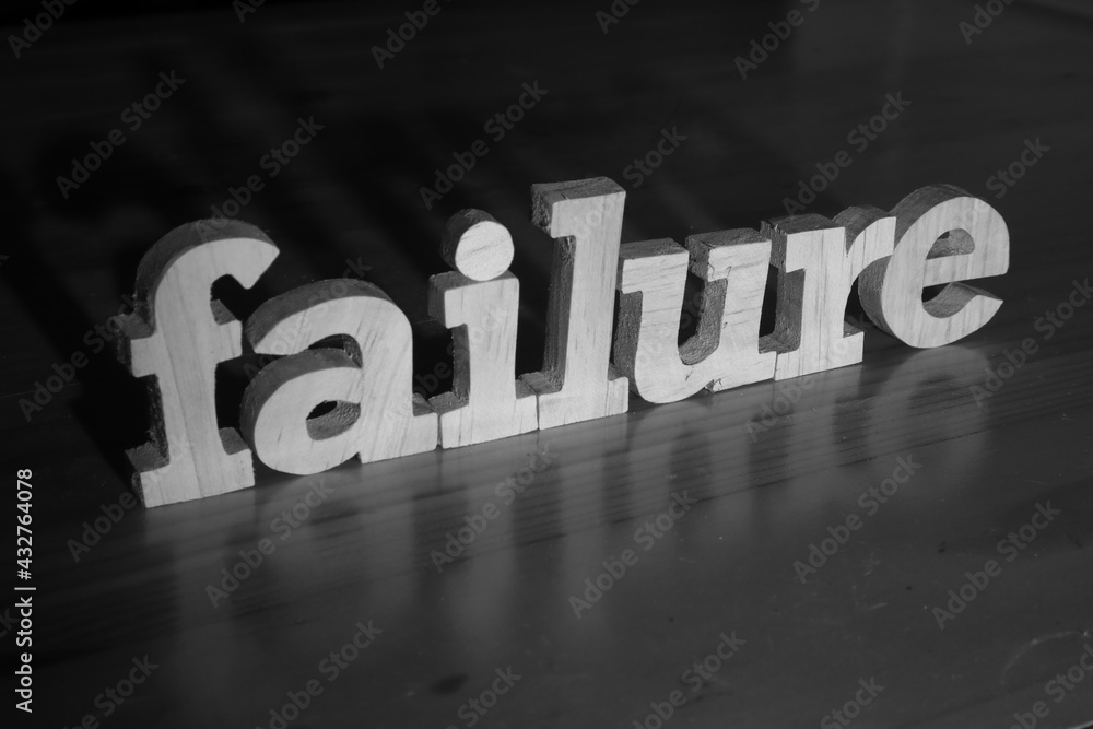 Failure, text words typography written with wooden letter on black background, life and business negativity Failure, text words typography written with wooden letter on black background, life and business negativity
