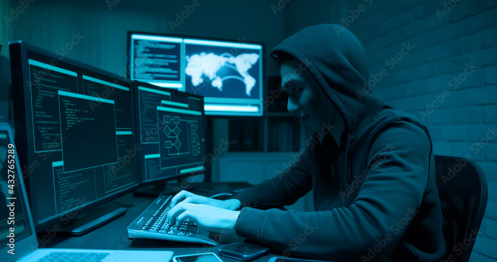 Asian male hacker use laptop Asian male hacker use laptop