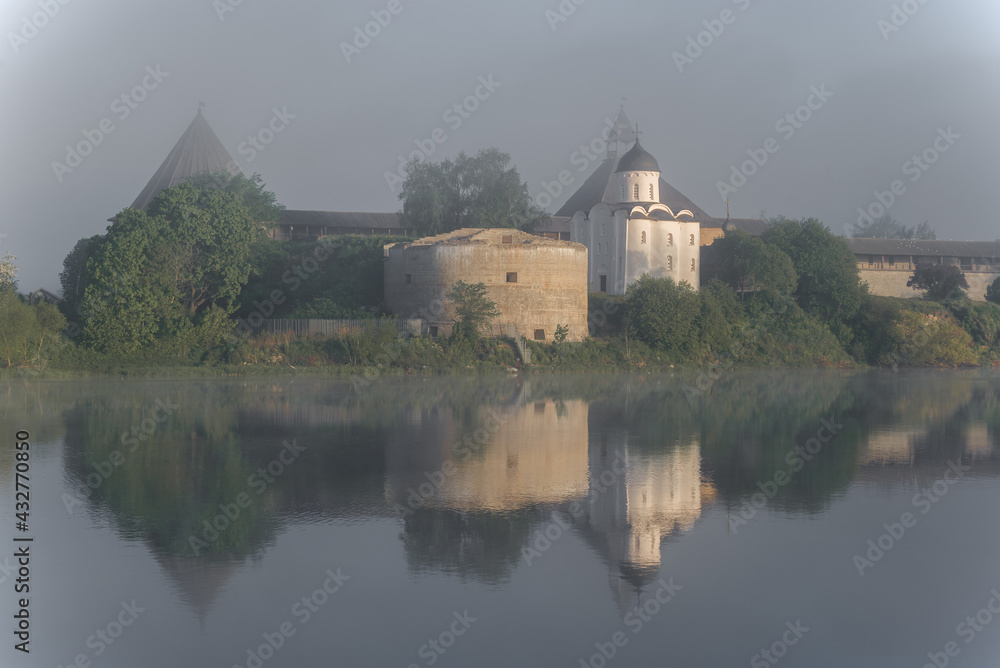 Foggy June morning at the ancient Old Ladoga fortress. Leningrad region, Russia