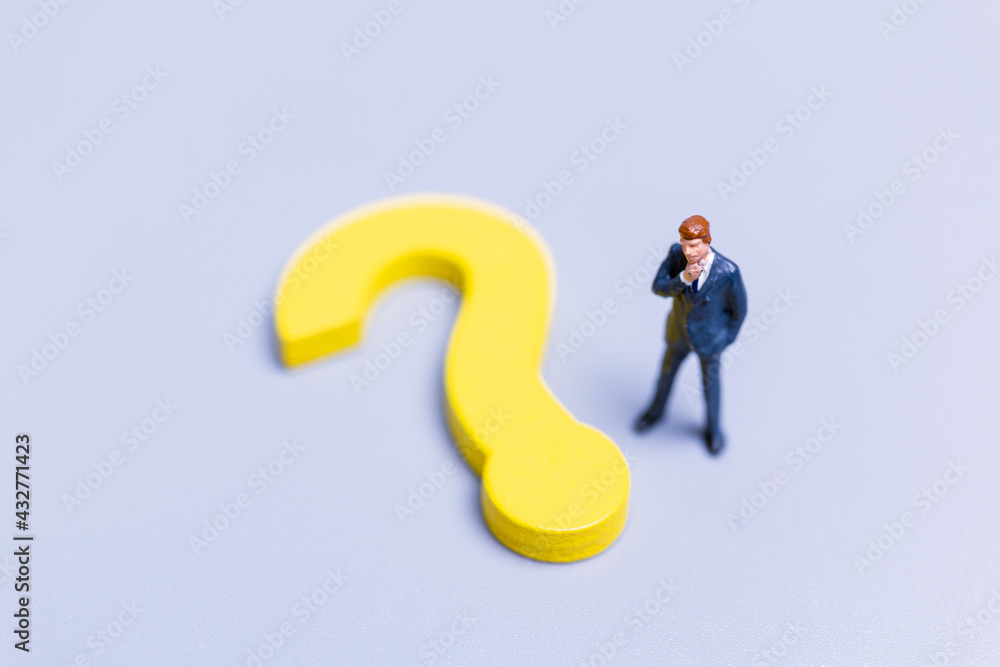 Businessman with big question. workers trying to solve the problem concept Businessman with big question. workers trying to solve the problem concept