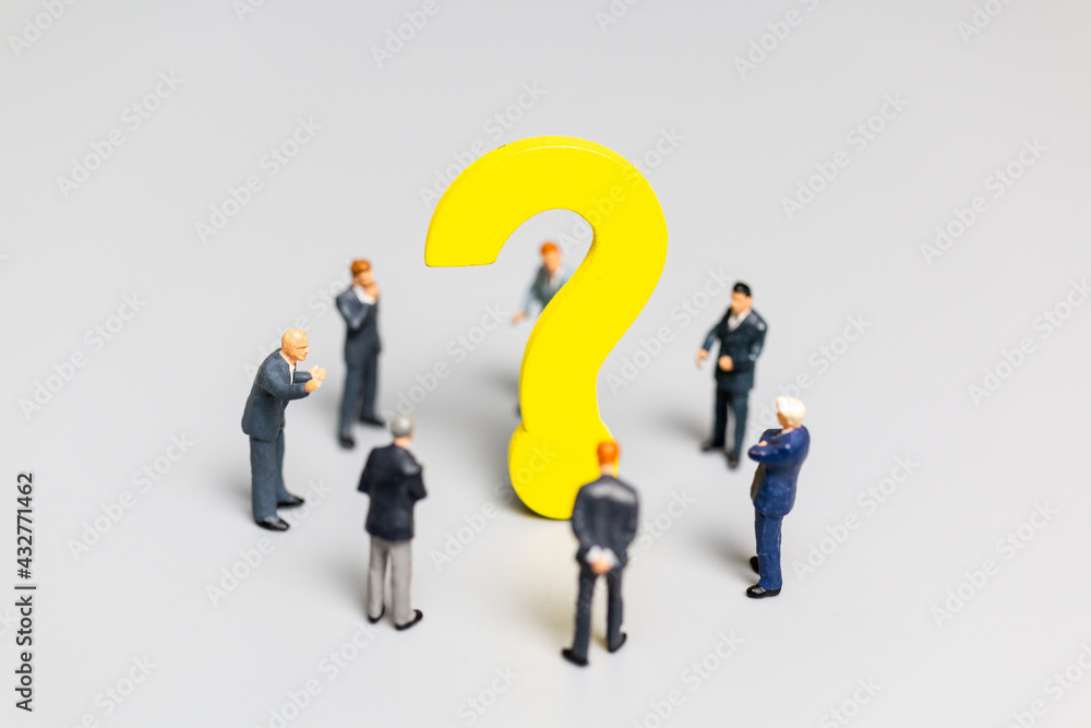 Businessman with big question. workers trying to solve the problem concept Businessman with big question. workers trying to solve the problem concept