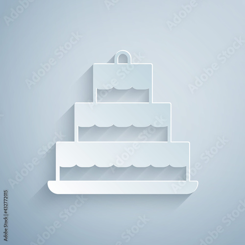 Quadro su tela Paper cut Cake with burning candles icon isolated on grey background