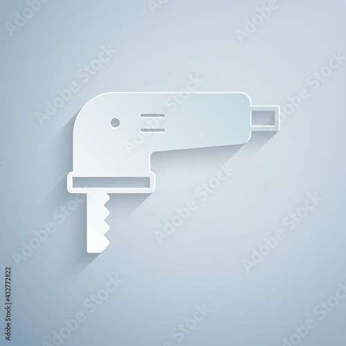 Paper cut Electric jigsaw with steel sharp blade icon isolated on grey background. Power tool for woodwork. Paper art style. Vector